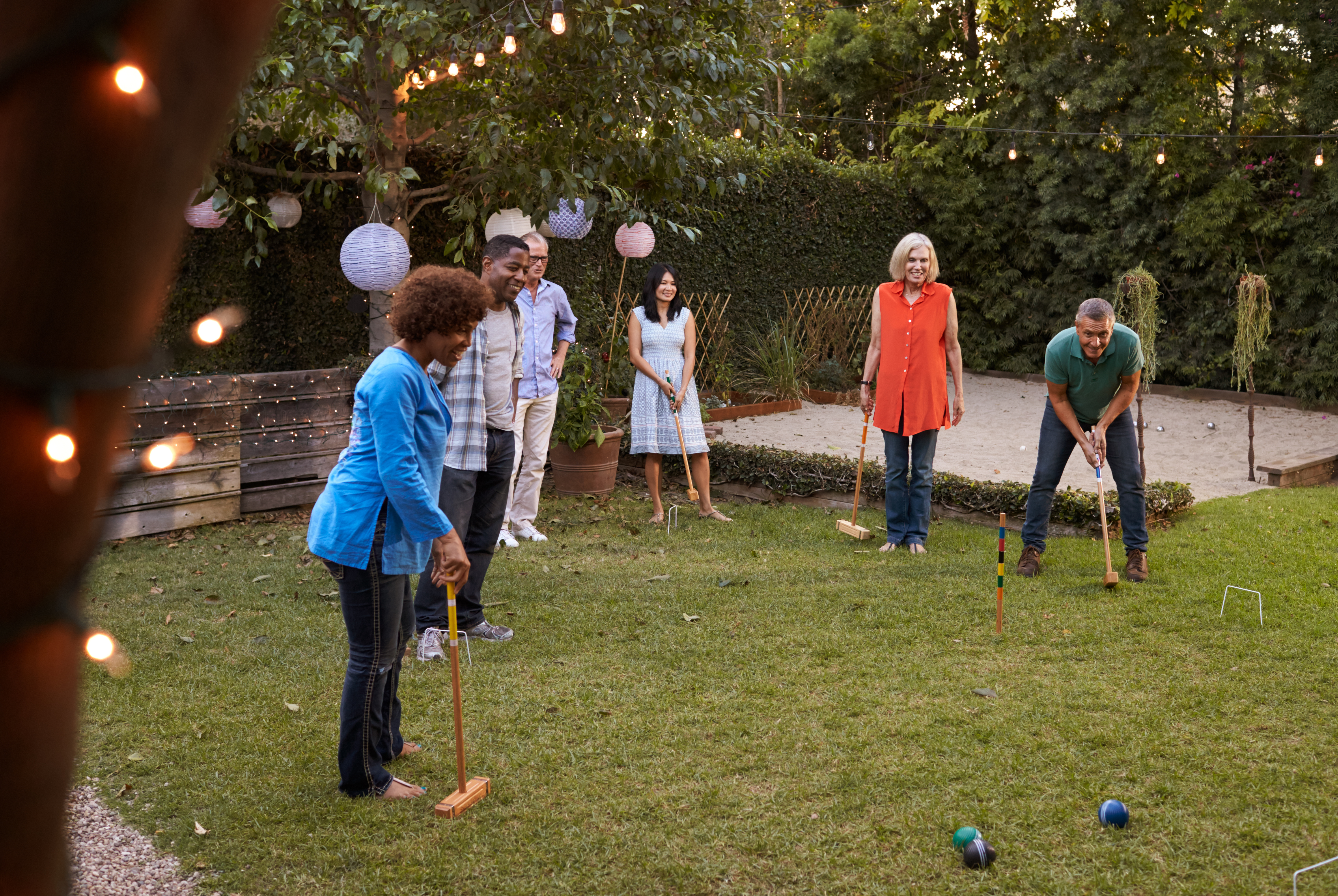 People playing croquet together