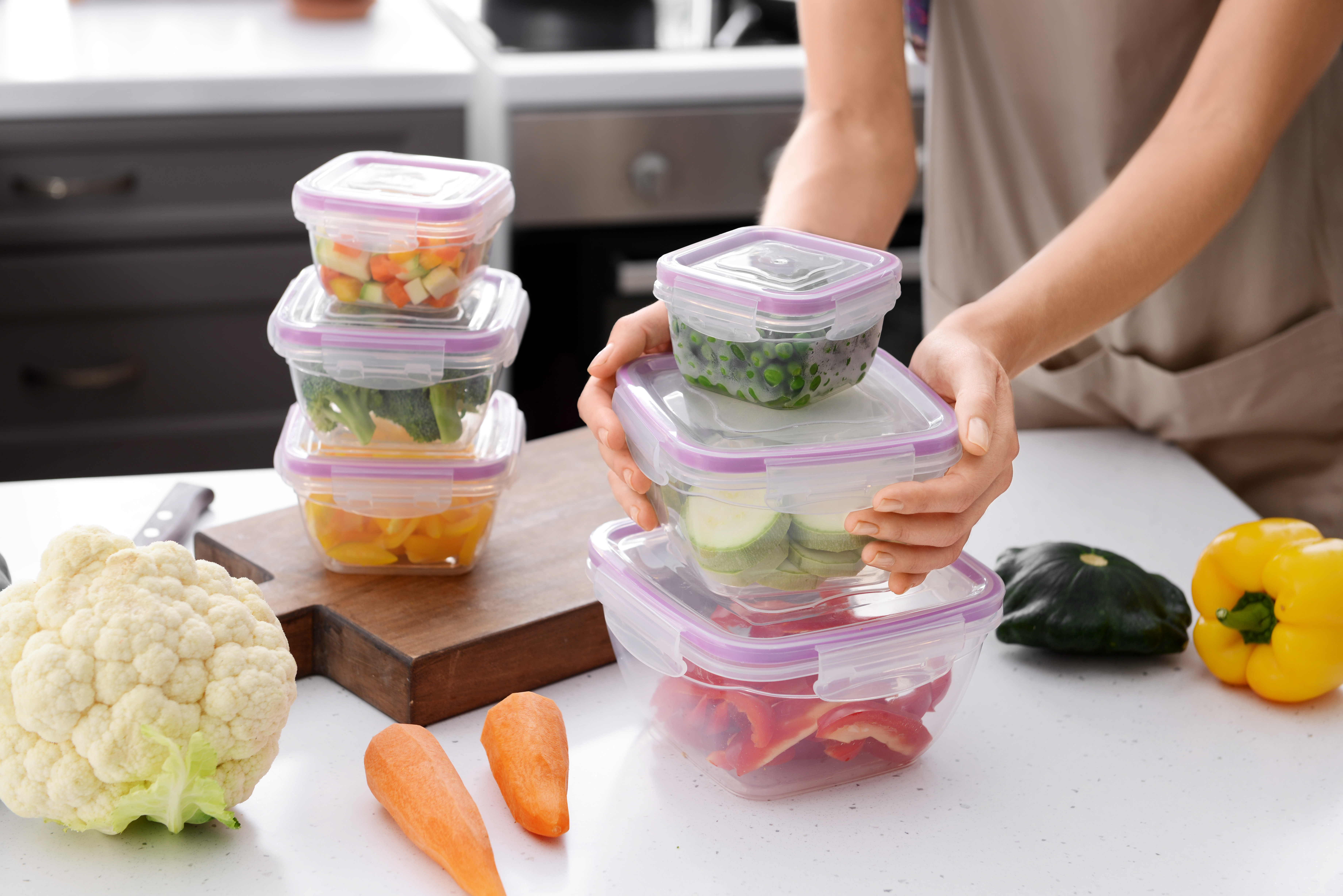 Person putting leftovers in containers