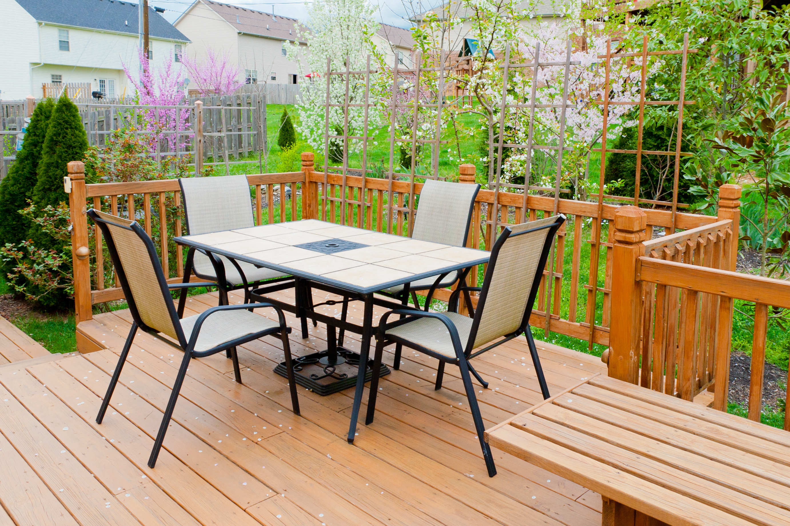 Clean table and chairs on patio in backyard