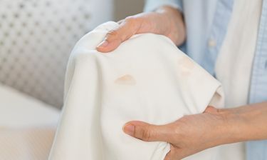 Close-up of a set-in stain on white piece of clothing