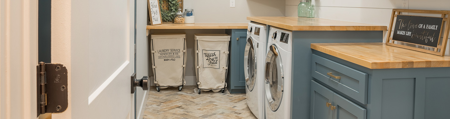 Modern laundry room with cabinets and countertops